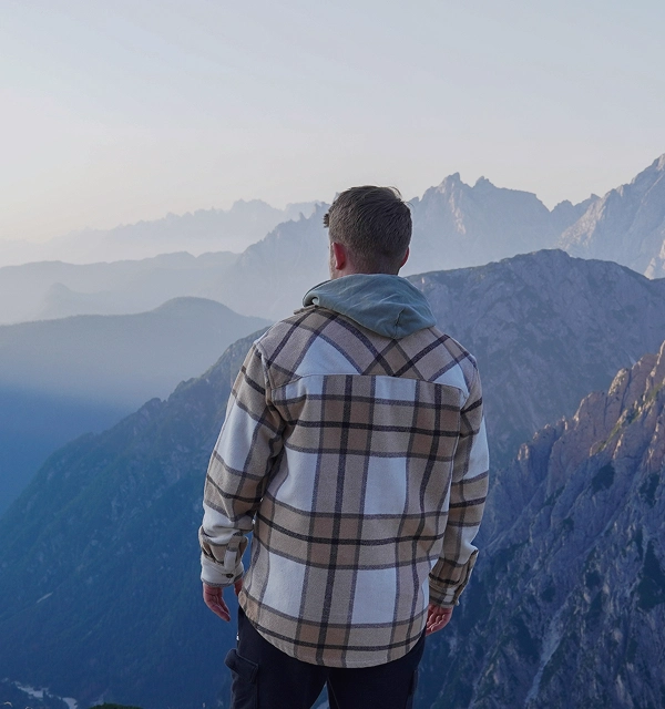 A person looking at the mountain view.