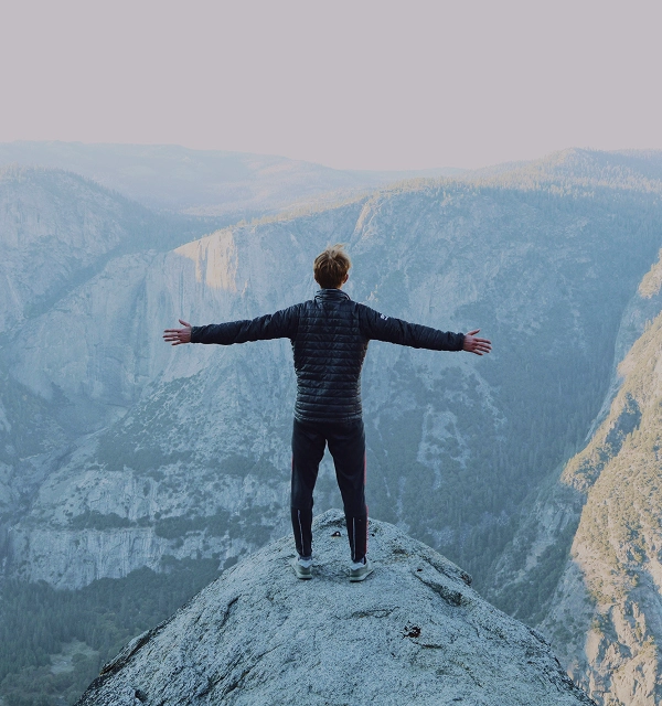 A person seeing the breathtaking mountain view.